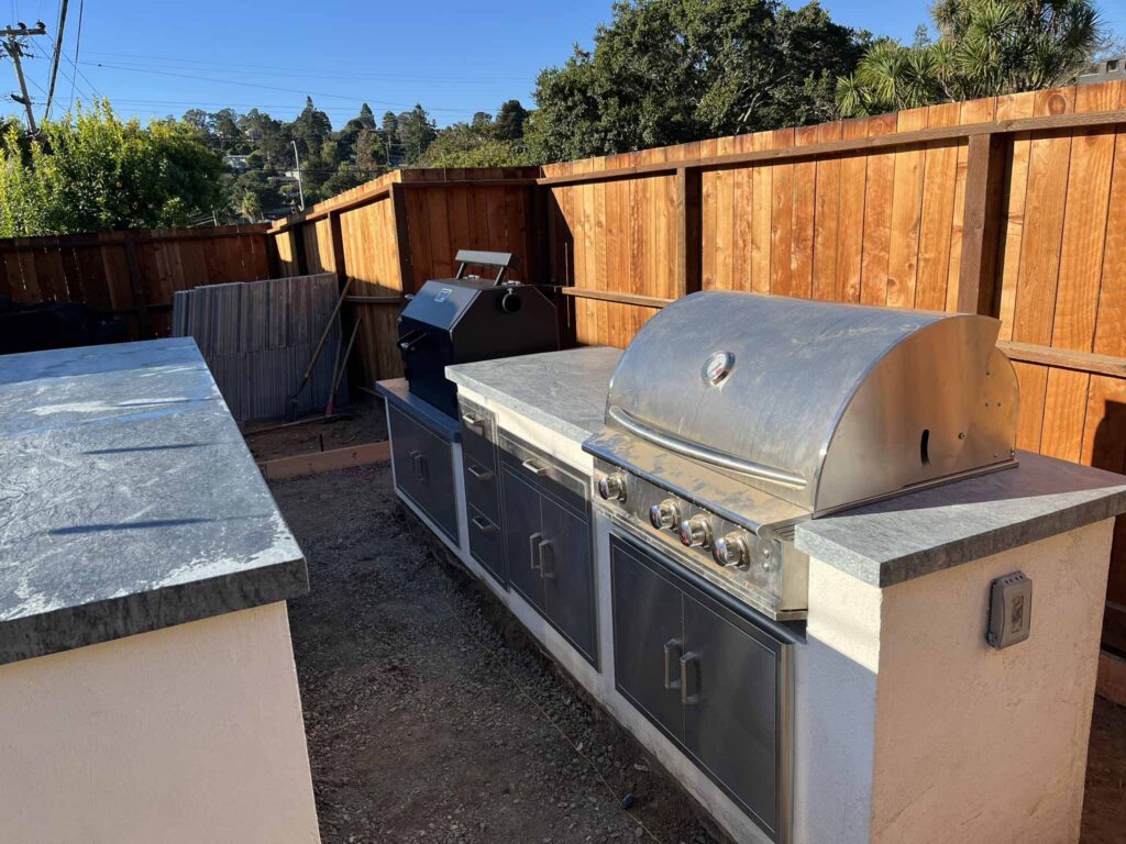 Backyard outdoor kitchen with built-in grill